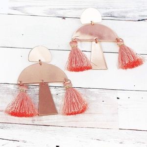 Rose gold tone, pink tassel earrings.